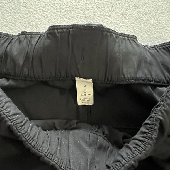Lululemon Women Solid Black On the Fly 7/8 Drawstring Luxtreme Travel Pant 2 - Picture 3 of 7
